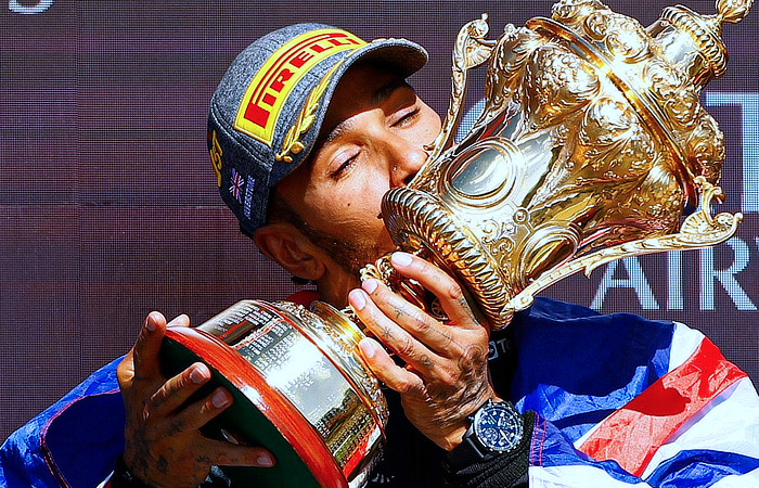 British Grand Prix - 2024 - Hamilton kisses the trophy on the podium