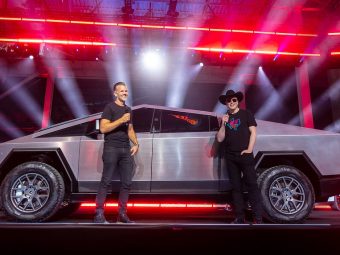 Elon Musk standing next to the Tesla Cybertruck 2022